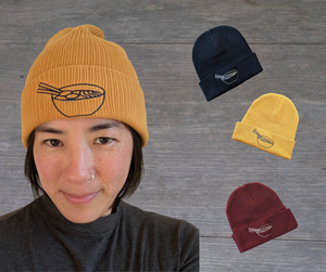 Mustard beanie shown on 21.5" head circumference model.